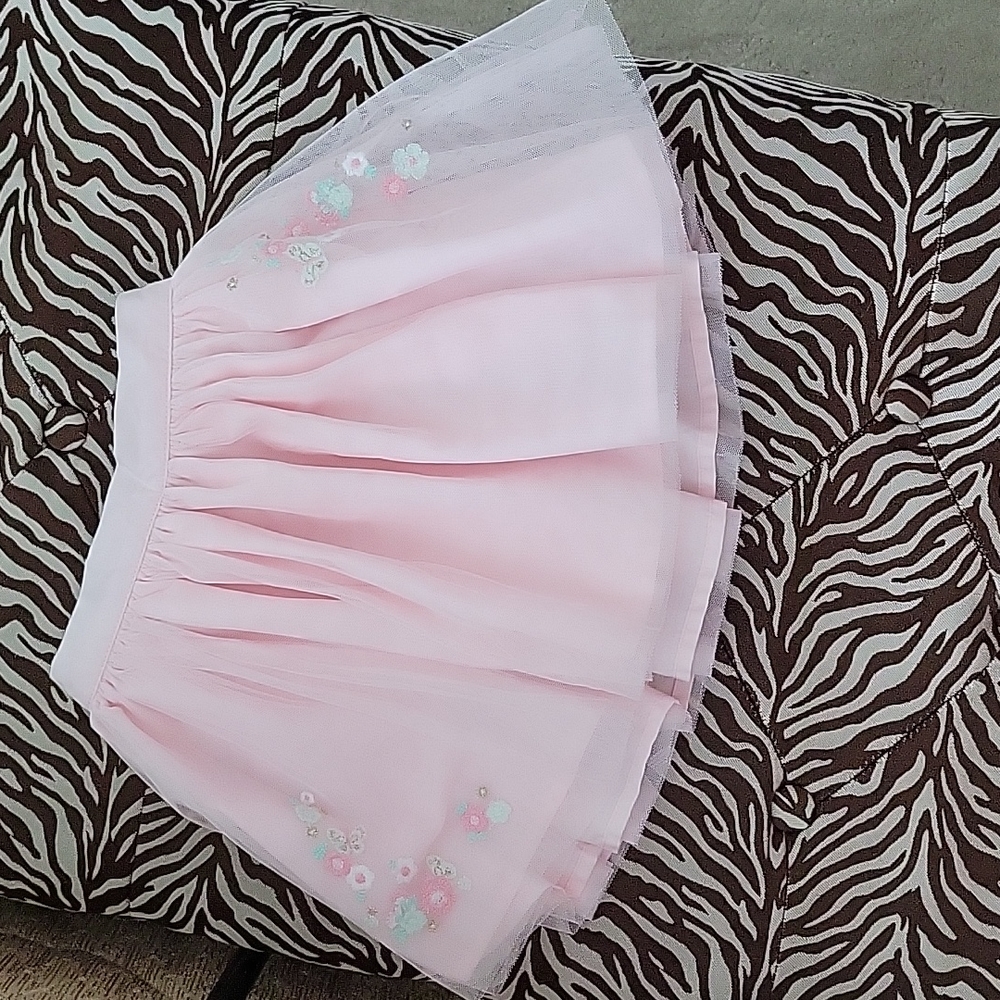 Pink skirt with floral decorations